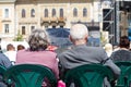 Elderly couple watching an outdoor show