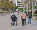 Elderly disabled person or senior on electric wheelchair or mobility scooter