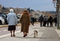 Elderly with dog and families with children