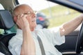 Elderly driver on phone