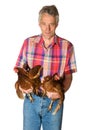 Elderly farmer with chicken