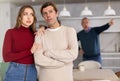 Elderly father scolds and shouts at a married couple. Quarrel in home kitchen Royalty Free Stock Photo