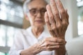 Elderly female patient suffer from numbing pain in hand,numbness fingertip,arthritis inflammation,beriberi or peripheral Royalty Free Stock Photo