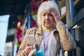 Elderly female reading something in the screen mobile phone Royalty Free Stock Photo