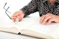 The elderly are flipping through the book to read and reeducate Royalty Free Stock Photo