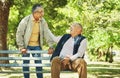 Elderly friends, laughing and relax at park bench, talking and bonding outdoor in retirement. Funny, smile and senior Royalty Free Stock Photo