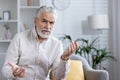 Senior man having a video call with a doctor from home Royalty Free Stock Photo