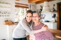 An elderly grandmother with an adult granddaughter at home.