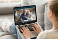 Elderly grandparents communicating with adult granddaughter using video call app