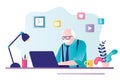 Elderly gray-haired businessman works on laptop. Male pensioner sits at desktop and works