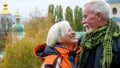 Elderly gray-haired optimistic couple