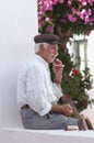 Elderly Greek man smokes a cigarette Royalty Free Stock Photo