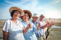 Elderly group traveling to the sea Royalty Free Stock Photo