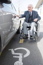 elderly handicapped man opening car door Royalty Free Stock Photo