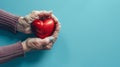 Elderly Hands Holding Red Heart.AI generated image Royalty Free Stock Photo