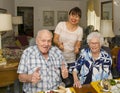 Elderly happily married couple celebrating the wife`s 87th birthday in their home. Royalty Free Stock Photo