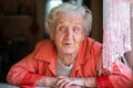 An elderly happy woman, ironic portrait. Royalty Free Stock Photo