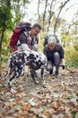 An elderly hikers couple and their dog having wonderful moments at a hike Royalty Free Stock Photo