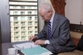 Senior Businessman Writing Notes Royalty Free Stock Photo