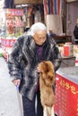 Elderly holding a fox