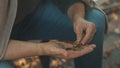 Elderly homeless man counting coins. Close up