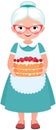 Elderly housewife grandmother wearing glasses and apron holding