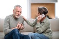 Woman calling emergency ambulance worried about old husband at home Royalty Free Stock Photo