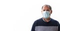 Elderly infected man in protective medical mask isolated in home quarantine. Coronavirus elderly advice concept. Safety old men.