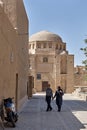 Elderly iranian tourists walk around the old city, Yazd, Iran.