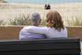 Elderly Jewish couple relax near Mediterranean beach