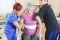 Elderly lady with her physiotherapists in a