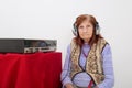 Elderly lady listening to the radio