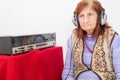 Elderly lady listening to the radio