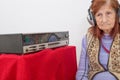 Elderly lady listening to the radio