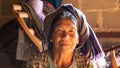 Elderly lady in a rural home on the country side of Myanmar along the Kalaw to Inle Lake hike. Royalty Free Stock Photo