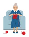 Elderly lady is sitting in a blue armchair and knits