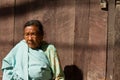 Elderly lady sitting in the sun in Kathmandu, Nepal