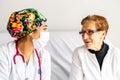 Old lady smiling while talking to the nurse Royalty Free Stock Photo
