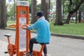 Elderly local Vietnamese man working out in Tao Dan Park