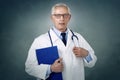 Elderly male doctor senior studio portrait Royalty Free Stock Photo