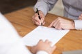 Elderly male hand signing document close up image Royalty Free Stock Photo