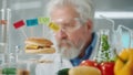 Elderly male researcher examines a sample of burger labeled E142, E240, E121 and E160. Biolog analyzes the quality of