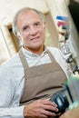 Elderly man in apron Royalty Free Stock Photo