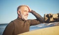 Elderly, man and beach to surf in summer for wellness, fitness and health on adventure. Senior, ocean and surfer in sun Royalty Free Stock Photo