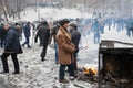 Elderly man in coat burn fire near the barricades Royalty Free Stock Photo