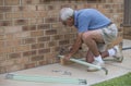 Elderly Man Hammering Nails And Wood. Royalty Free Stock Photo