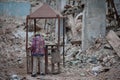 Elderly Man in a Crumbling Building Site