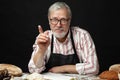 Elderly man demonstrating assortment of bakery. Homemade pastries, rural style Royalty Free Stock Photo