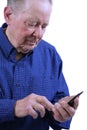 Elderly man dialing cell phone Royalty Free Stock Photo
