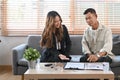 Elderly asian man discussing property purchase with financial advisor. Royalty Free Stock Photo